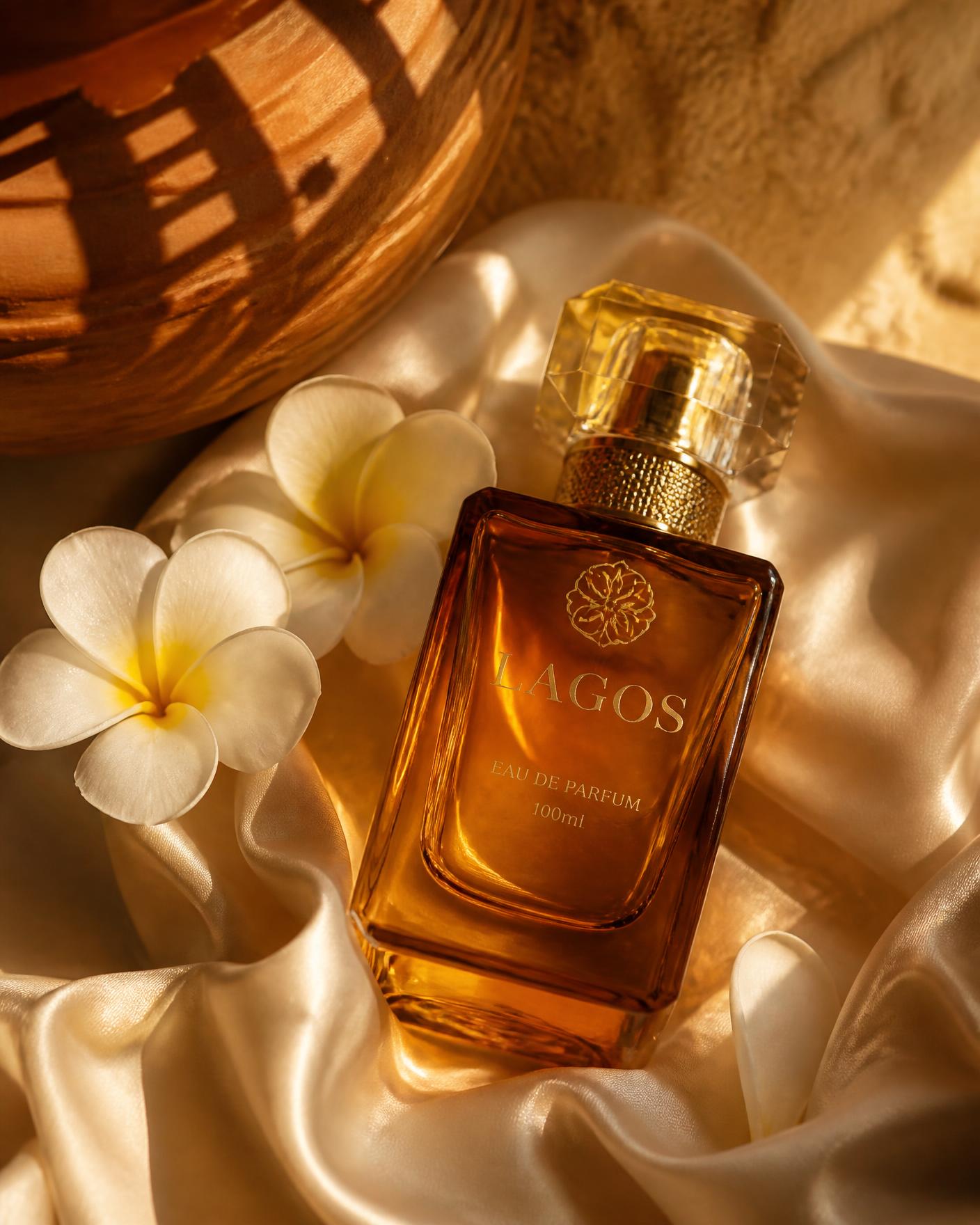 Amber Simi Secret perfume bottle resting on cream silk in warm Lagos sunlight